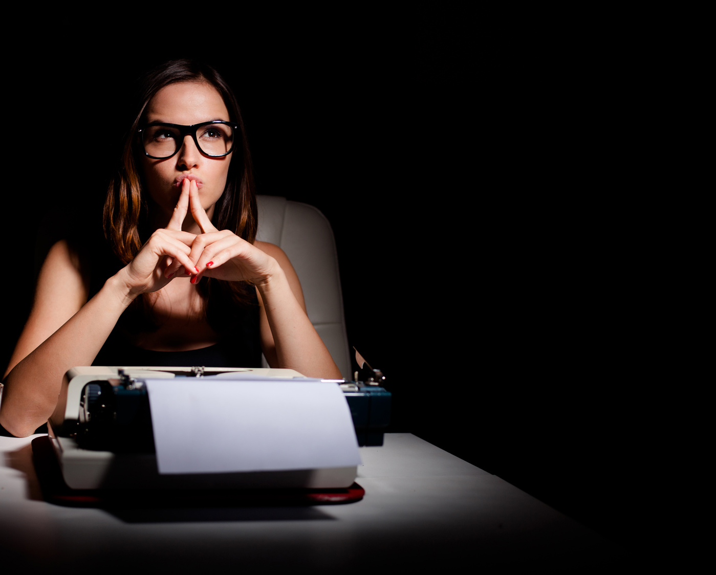Pensive writer working on her book
